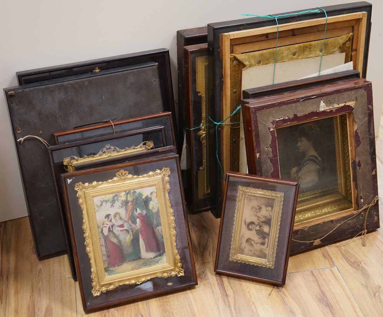 Fifteen mahogany and gilt frames, some containing prints on opaque white glass and some hand coloured prints, largest overall 53 x 46cm, housed in ornate gilt frames
